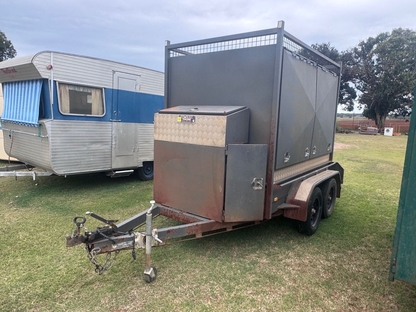 A Metal Trailer with Caged Enclosure — Bundaberg Auction Centre in Gooburrum, QLD