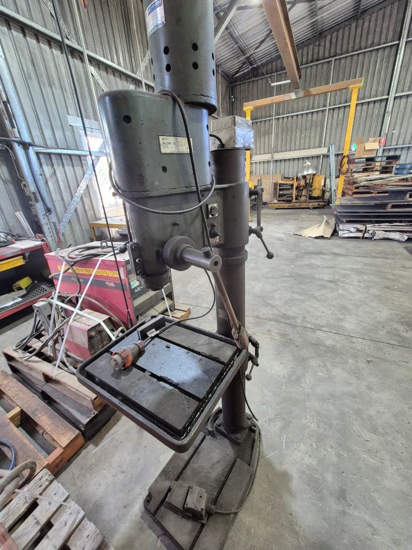 Dark Gray Industrial Drill Press in A Workshop — Bundaberg Auction Centre in Gooburrum, QLD