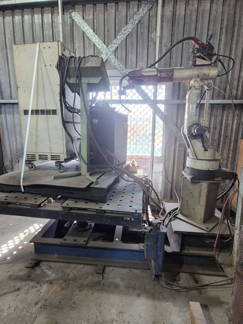 Industrial Welding Robot with Attached Machinery in A Workshop — Bundaberg Auction Centre in Gooburrum, QLD