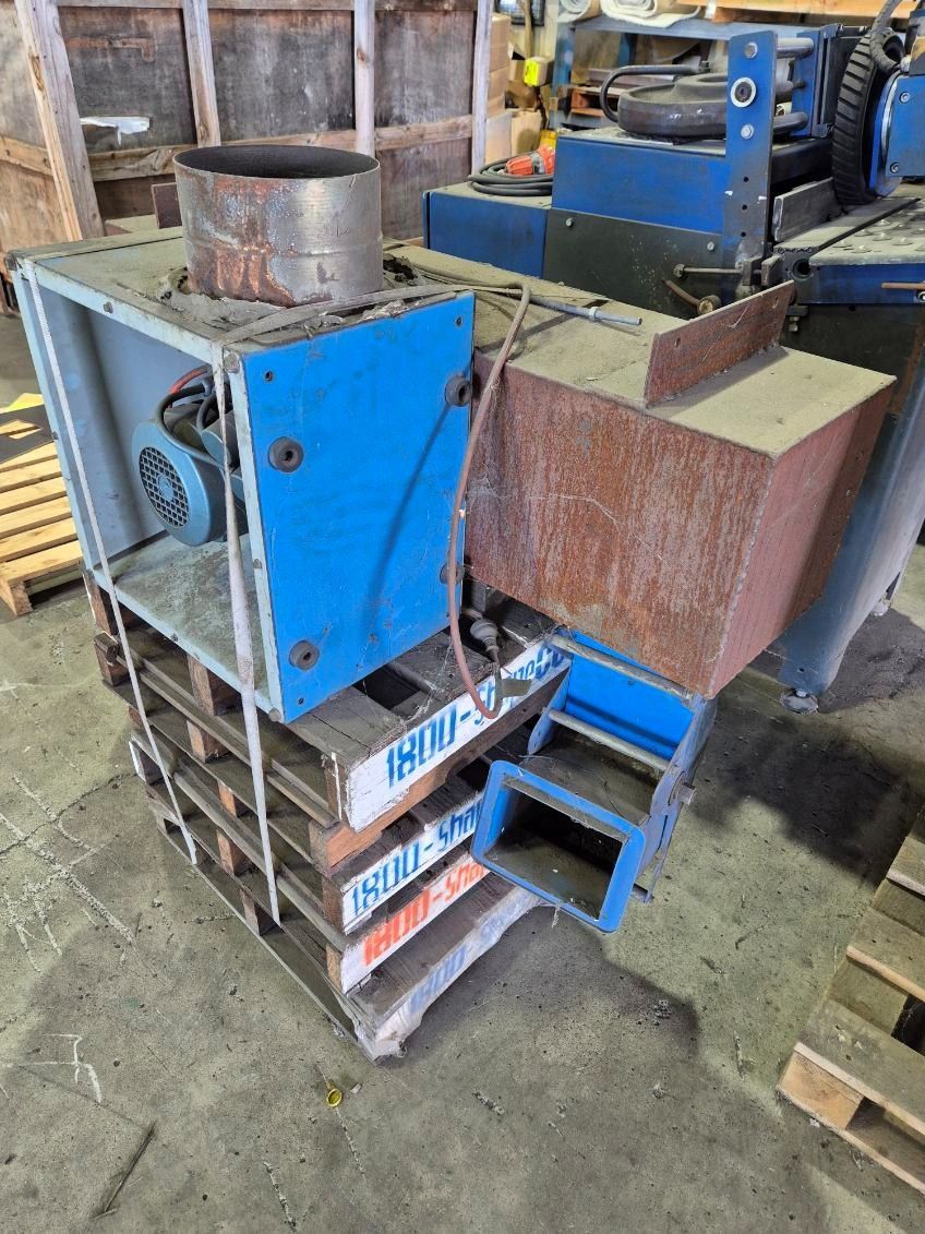 Blue and Rusty Industrial Machine on Wooden Pallets — Bundaberg Auction Centre in Gooburrum, QLD