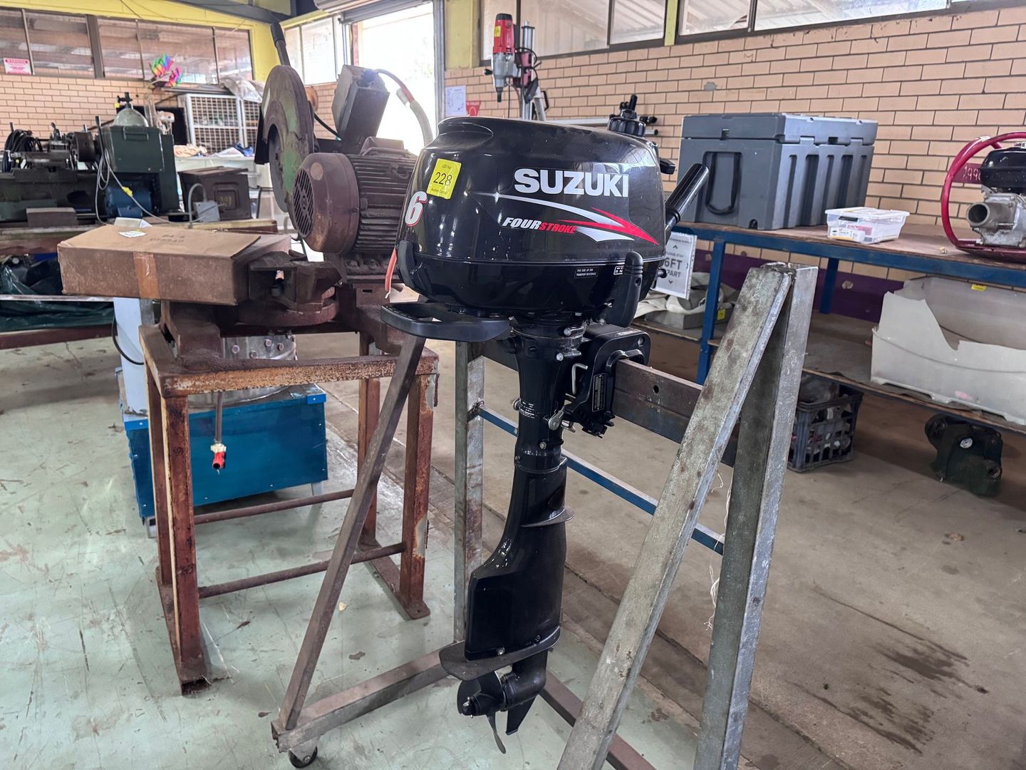 Suzuki Outboard Motor on A Stand in A Workshop Setting — Bundaberg Auction Centre in Gooburrum, QLD