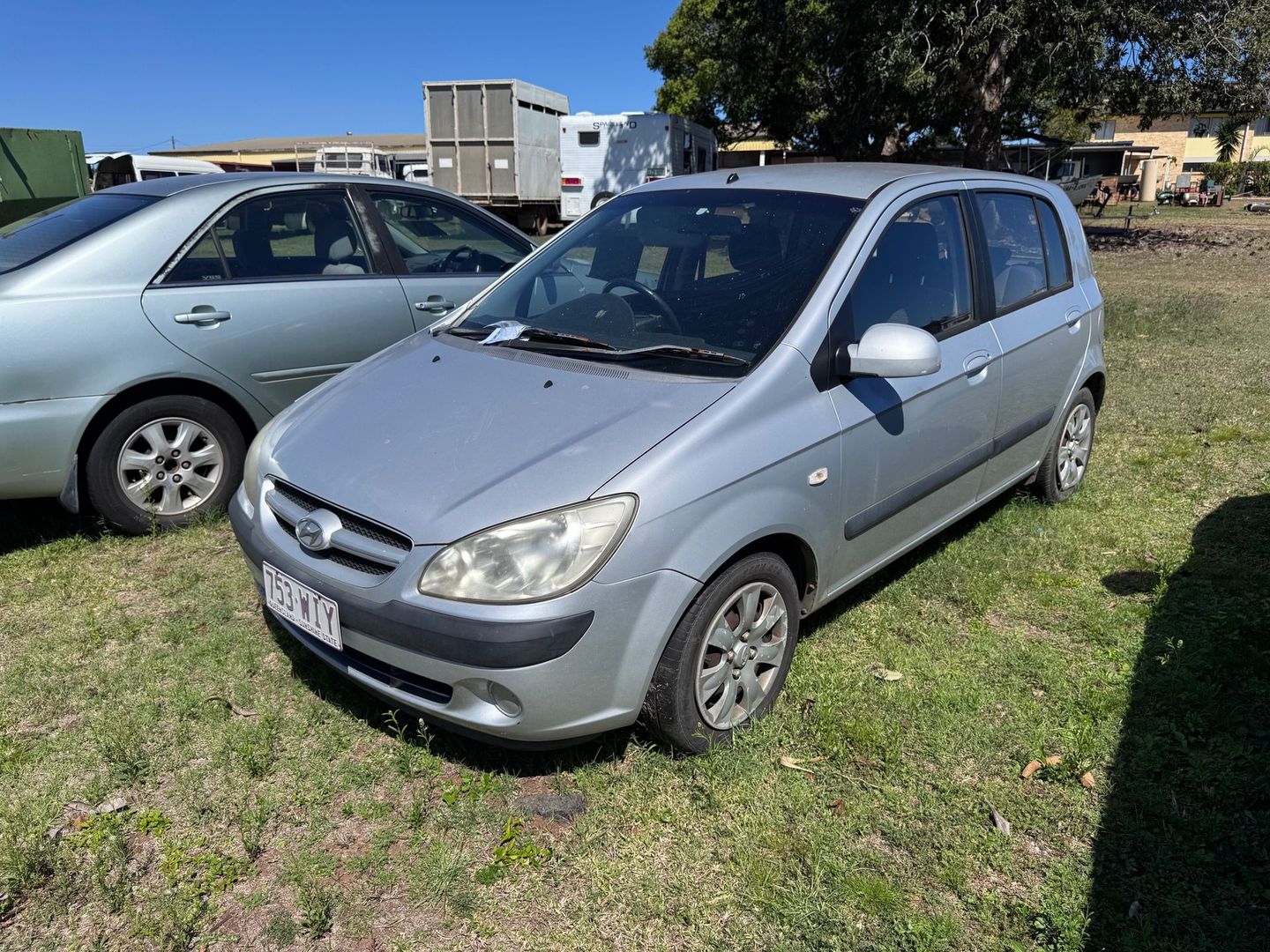 Silver Hyundai Getz Hatchback Parked on Grass — Bundaberg Auction Centre in Gooburrum, QLD