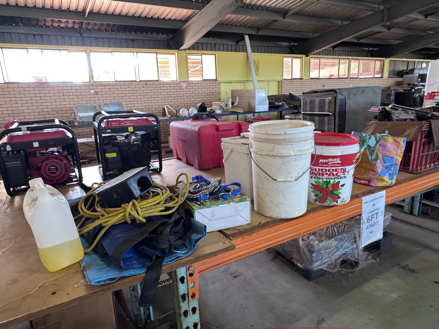 A Table with Generators, Buckets, and Supplies — Bundaberg Auction Centre in Gooburrum, QLD
