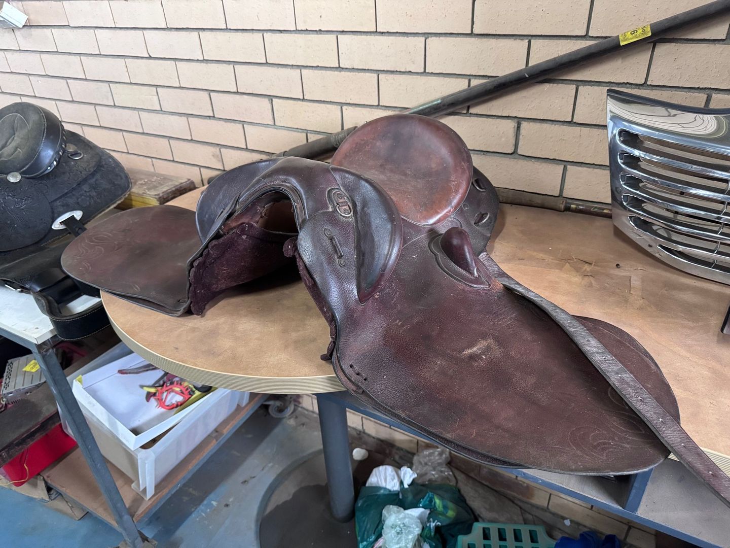 Brown Leather Horse Saddle on A Small Round Table — Bundaberg Auction Centre in Gooburrum, QLD