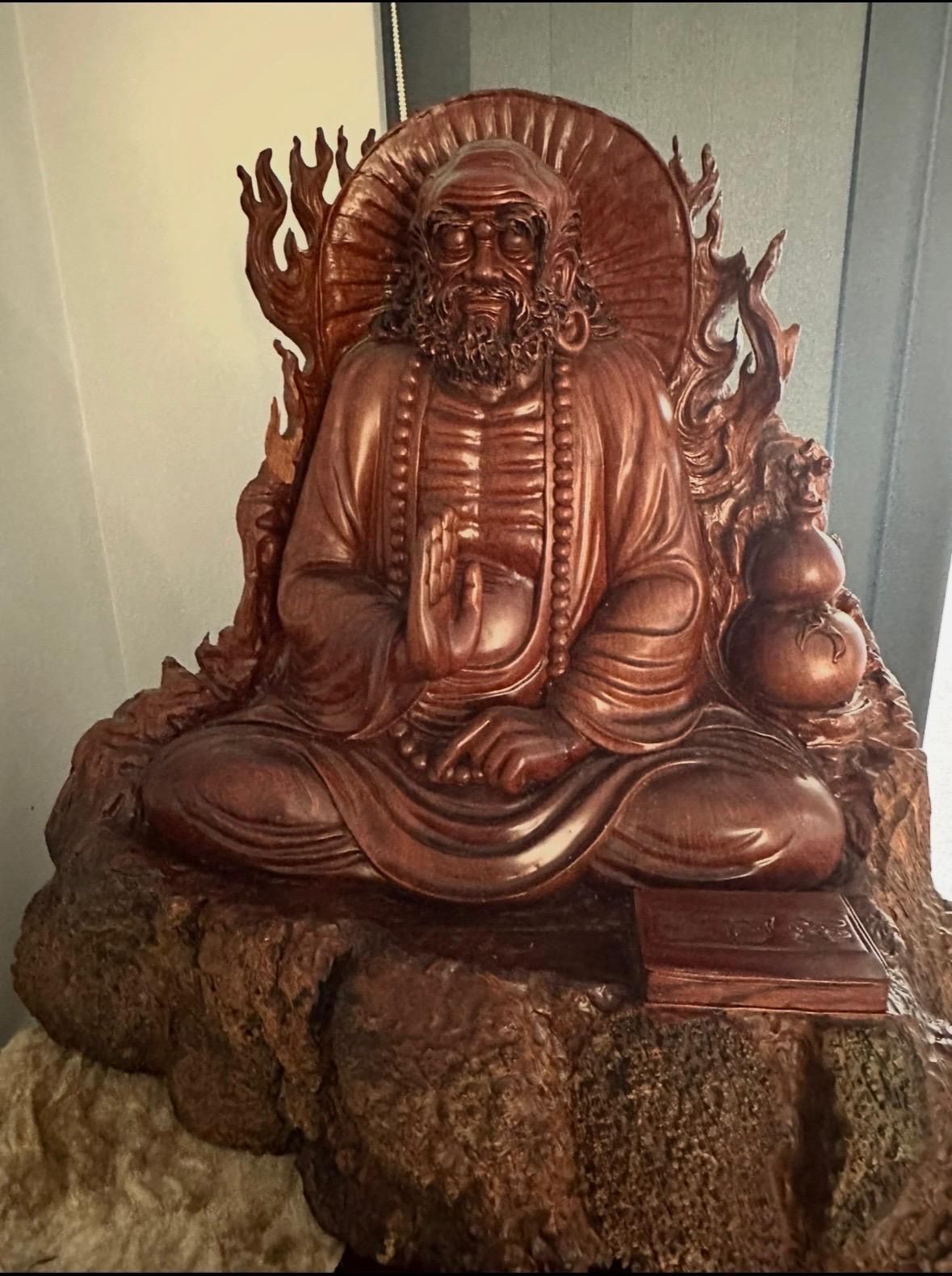 Wooden Statue of A Seated Figure with A Beard — Bundaberg Auction Centre in Gooburrum, QLD