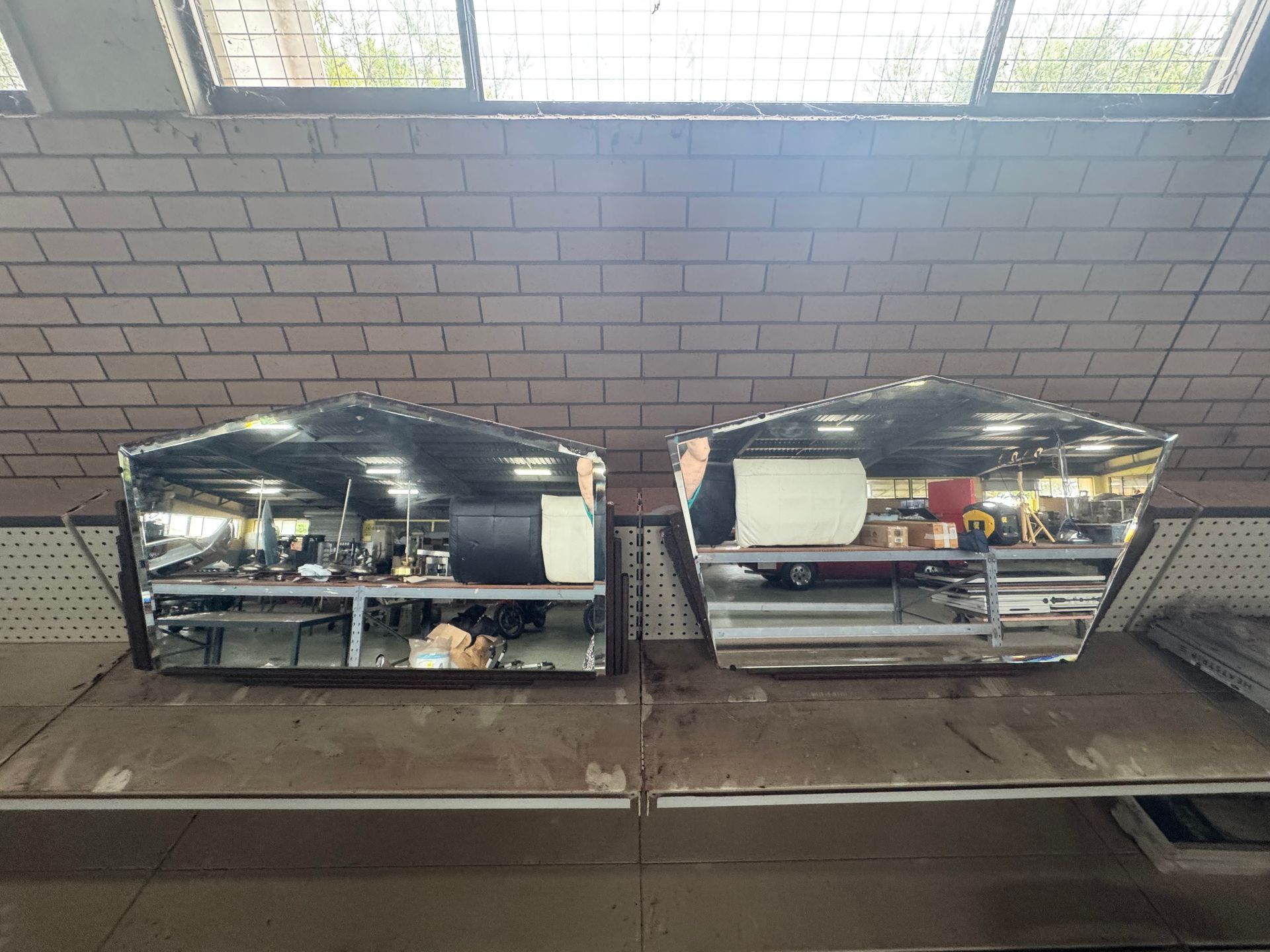 Two Reflective, Geometric Metal Structures Sit on A Shelf — Bundaberg Auction Centre in Gooburrum, QLD