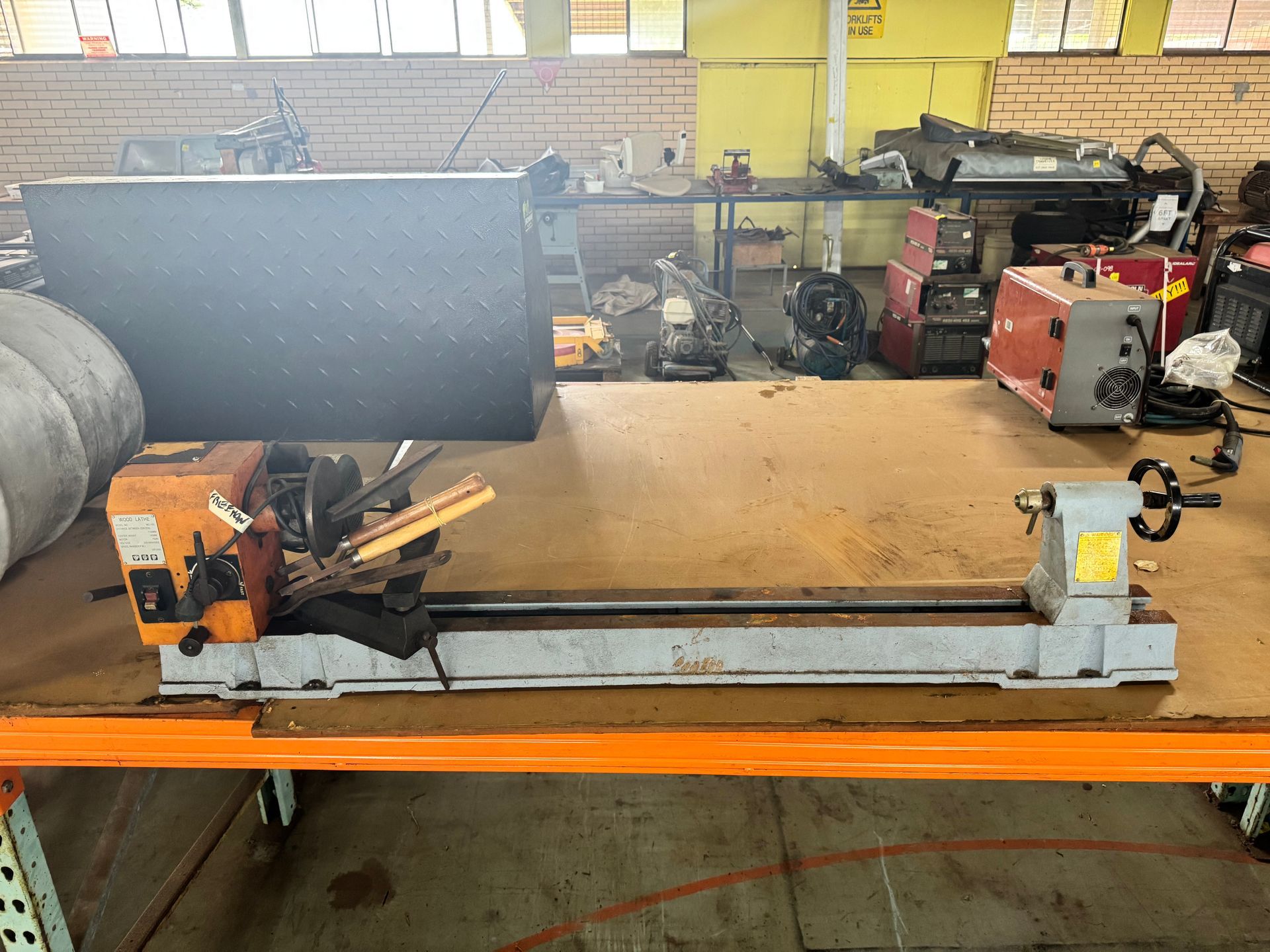 A Wood Lathe on A Workbench with Other Tools in The Background — Bundaberg Auction Centre in Gooburrum, QLD