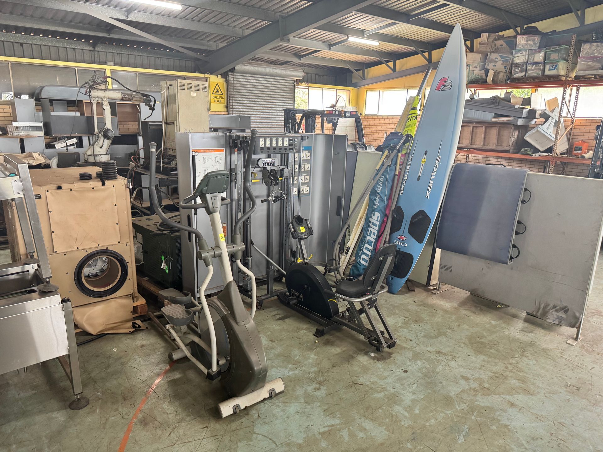 An Industrial Space with Exercise Equipment and Other Machinery — Bundaberg Auction Centre in Gooburrum, QLD