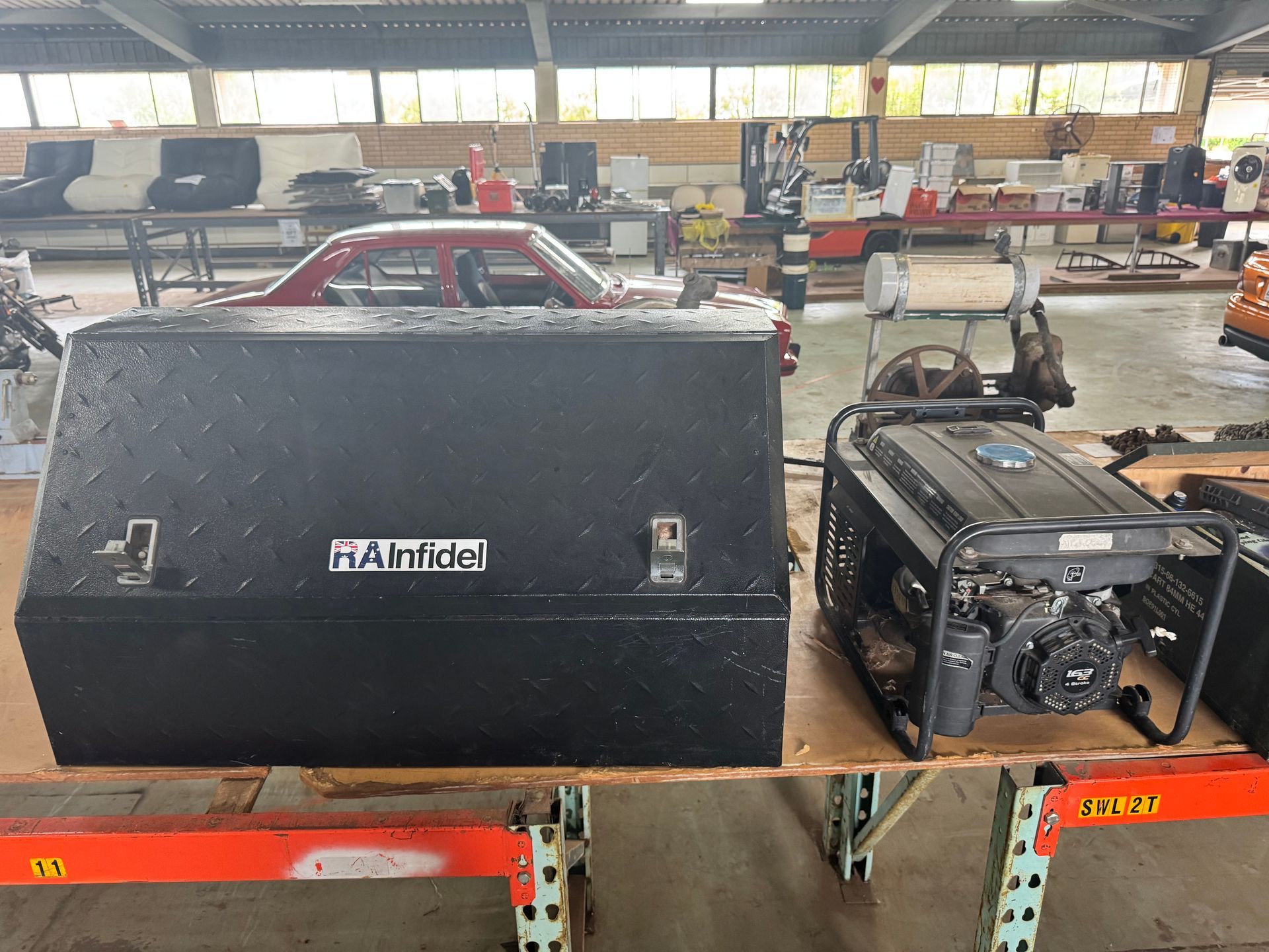 Black Toolbox and Generator on A Shelf in A Workshop — Bundaberg Auction Centre in Gooburrum, QLD