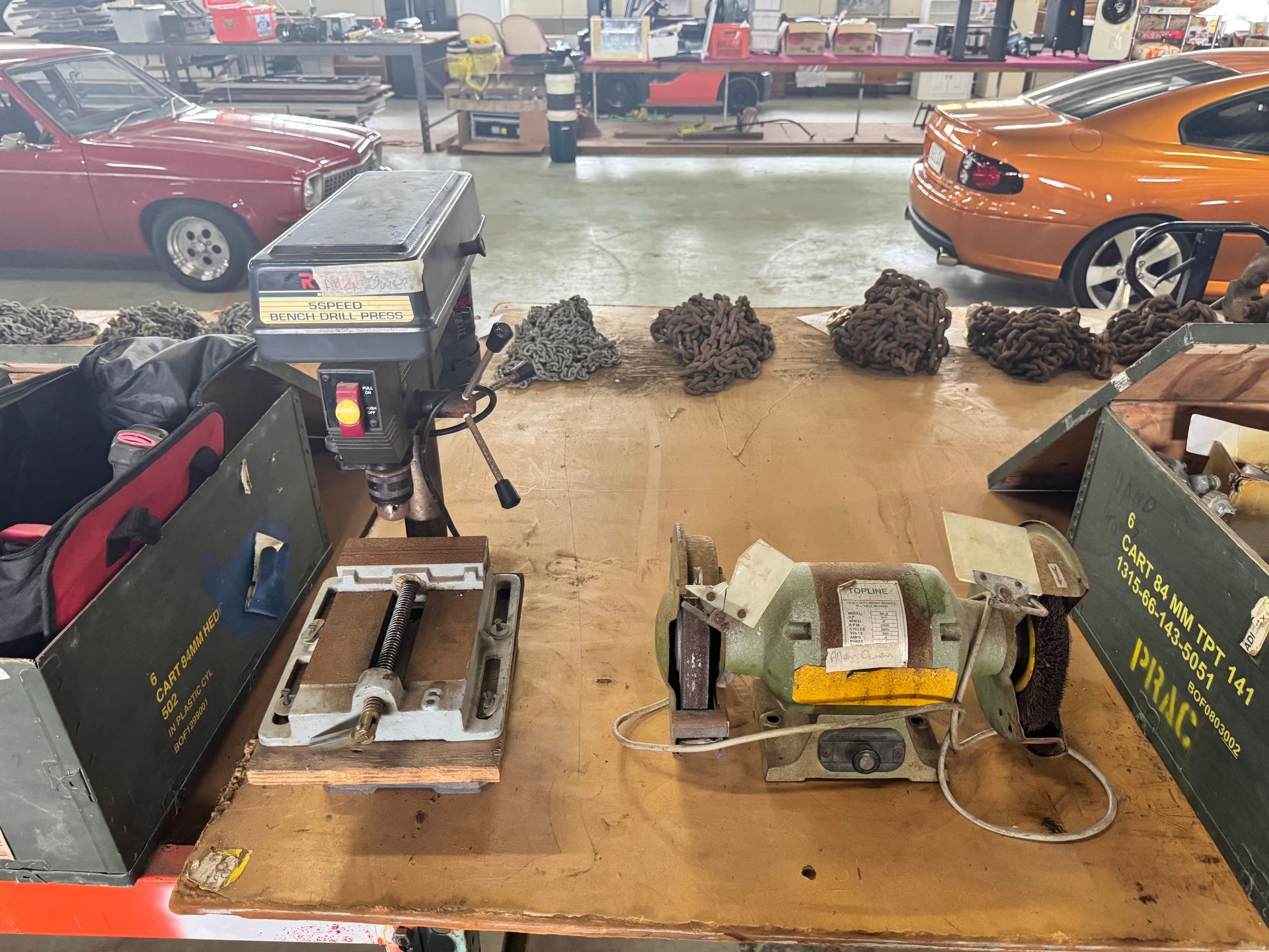 Drill Press and Bench Grinder on A Workbench with Cars in The Background  — Bundaberg Auction Centre in Gooburrum, QLD