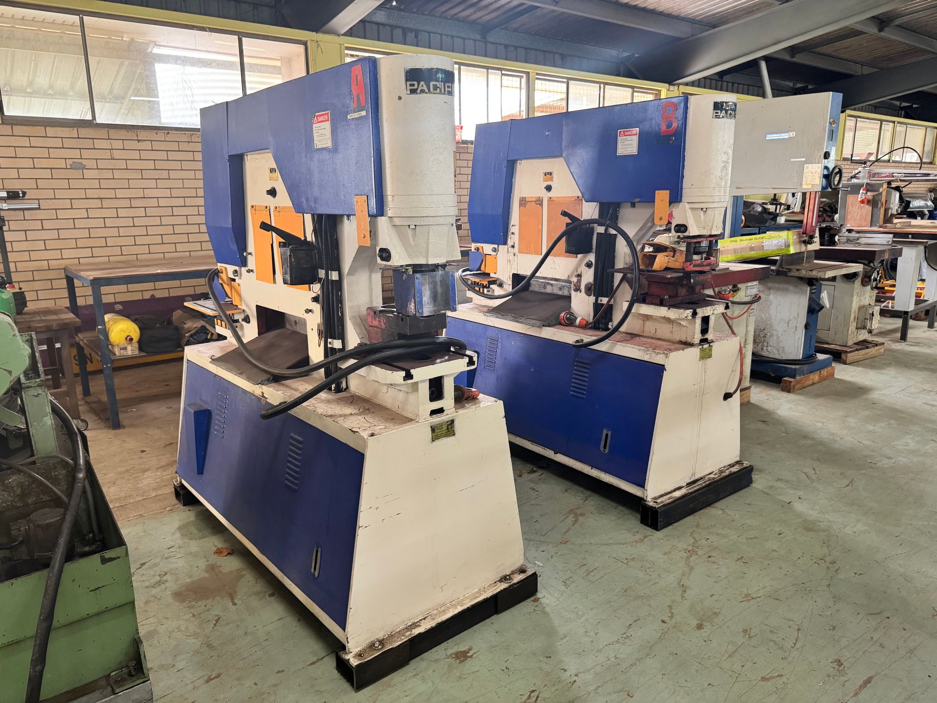 Two Blue and White Industrial Punching Machines in A Workshop — Bundaberg Auction Centre in Gooburrum, QLD