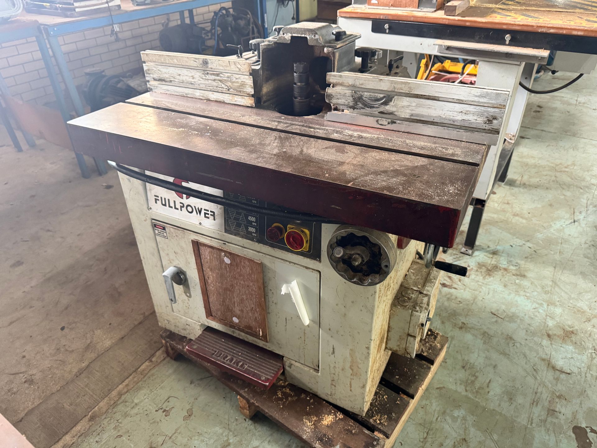 A Stationary Woodworking Router Machine with A Table and A Dark Brown Top — Bundaberg Auction Centre in Gooburrum, QLD