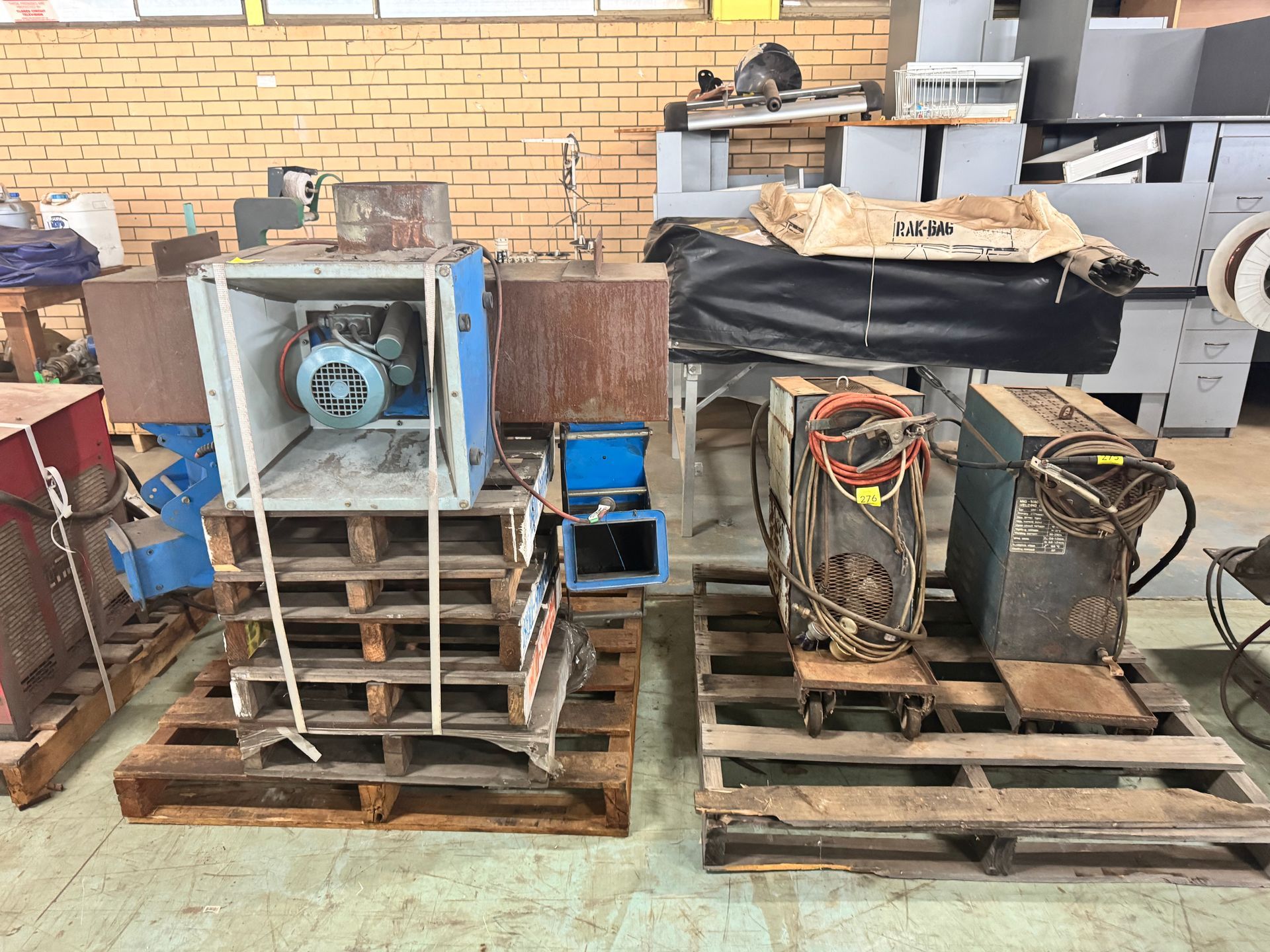 Two Pallets with Industrial Equipment: Blue Machinery in Cages — Bundaberg Auction Centre in Gooburrum, QLD