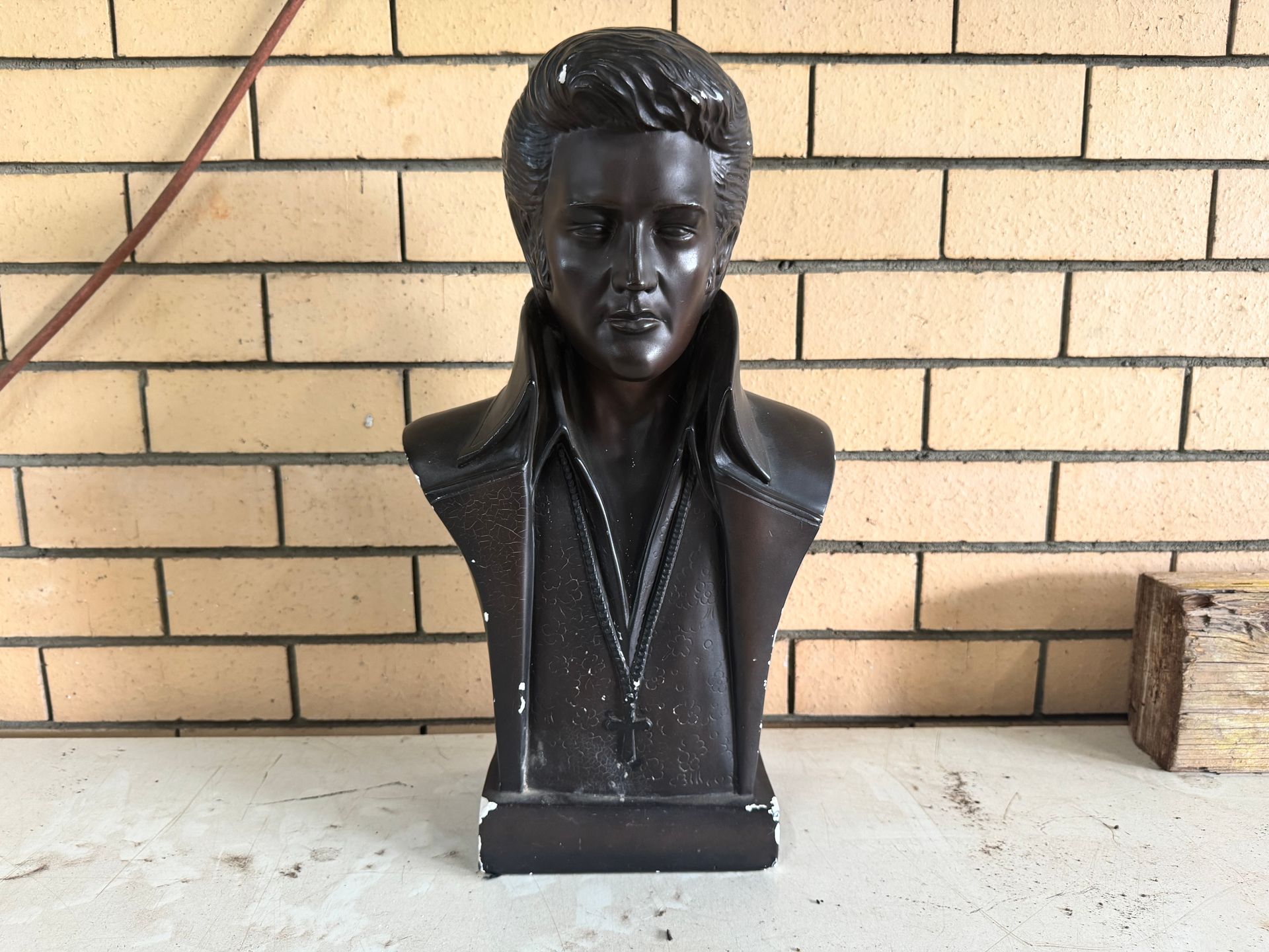 Bronze Bust of Elvis Presley, Wearing a Jacket, Set in Front of A Brick Wall — Bundaberg Auction Centre in Gooburrum, QLD