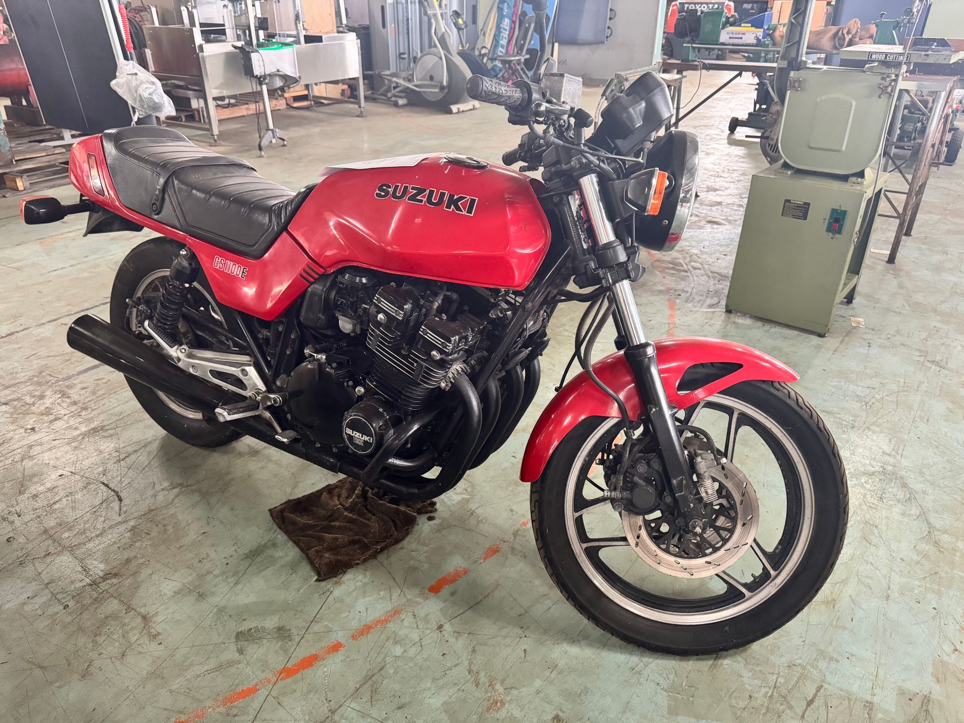 Red Suzuki Motorcycle Parked Inside a Workshop — Bundaberg Auction Centre in Gooburrum, QLD