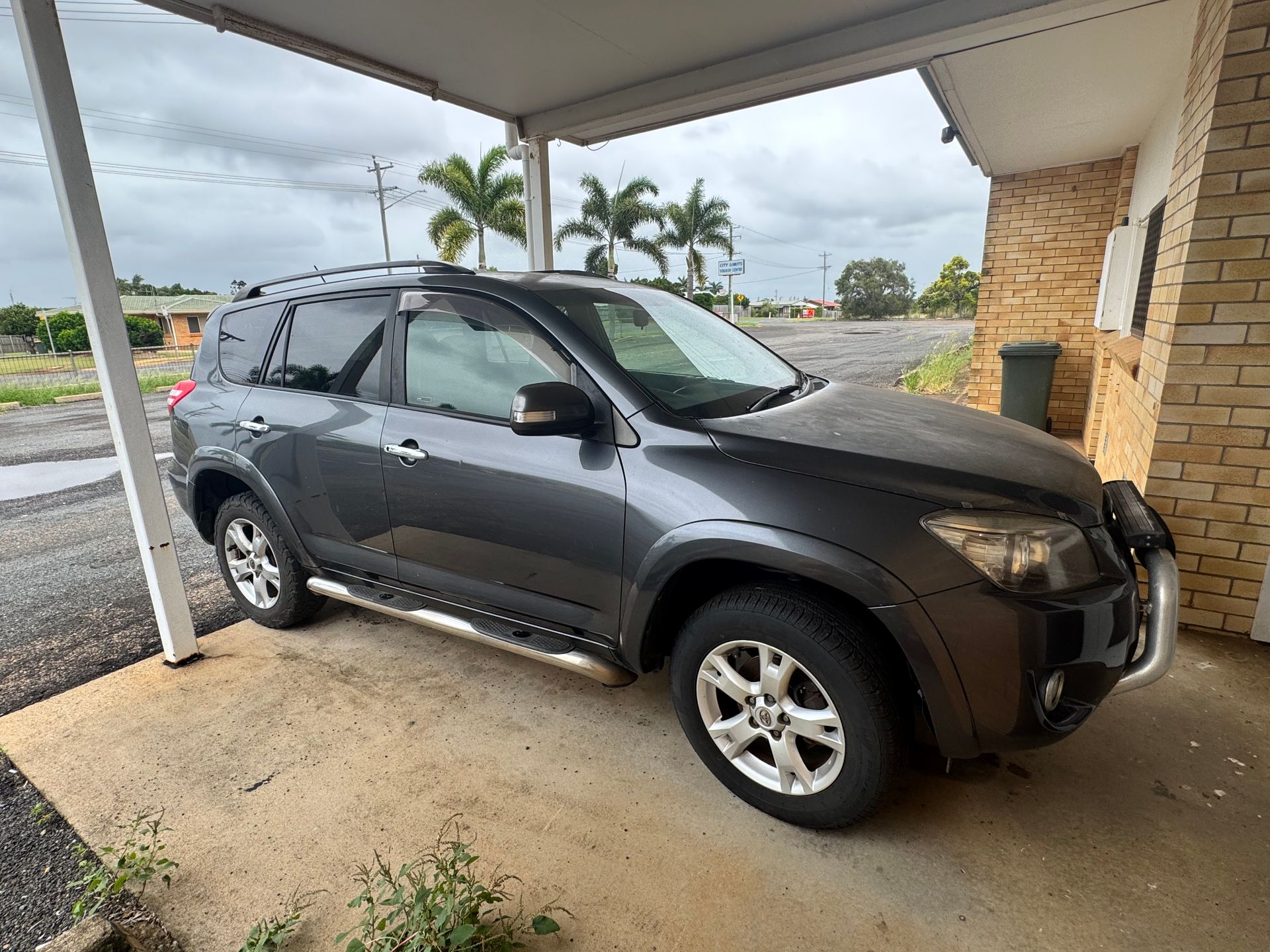 Dark Gray Toyota Rav4 Parked Under a Covered Area, with A Cloudy Sky in The Background — Bundaberg Auction Centre in Gooburrum, QLD