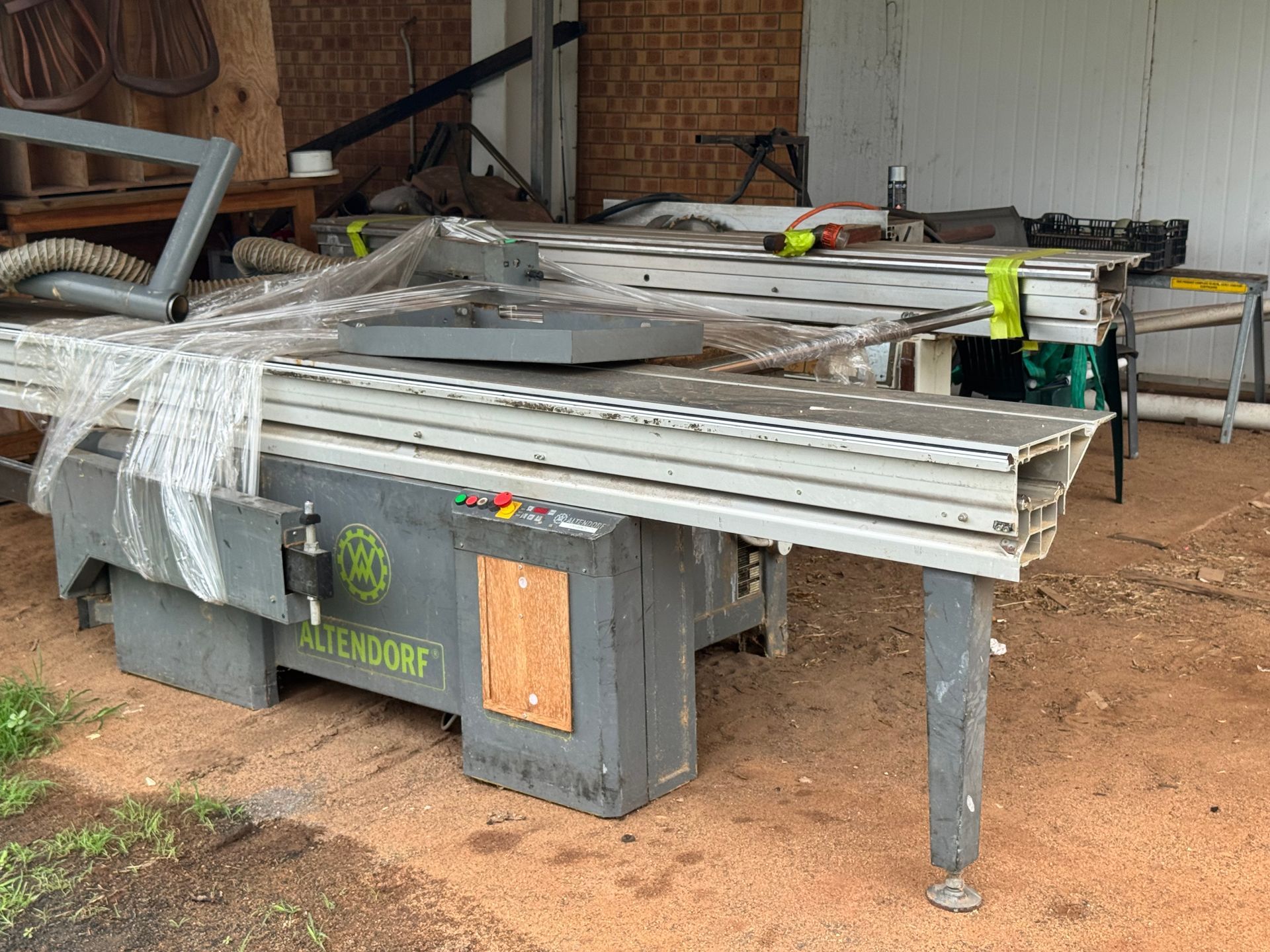 Large Woodworking Saw in A Workshop Setting. the Saw Is Grey and Silver with A Long Table — Bundaberg Auction Centre in Gooburrum, QLD