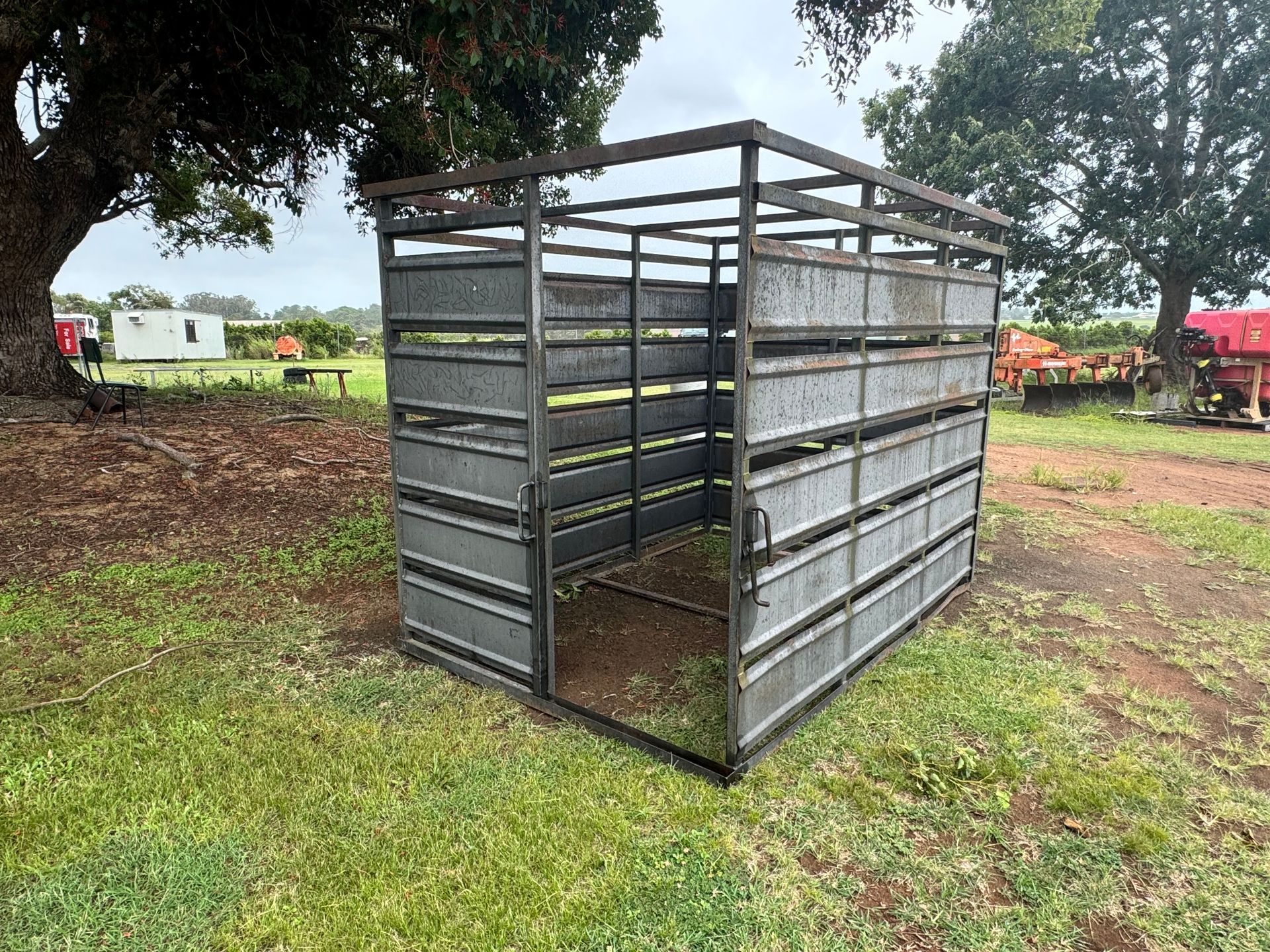 Metal Livestock Pen in A Grassy Field — Bundaberg Auction Centre in Gooburrum, QLD