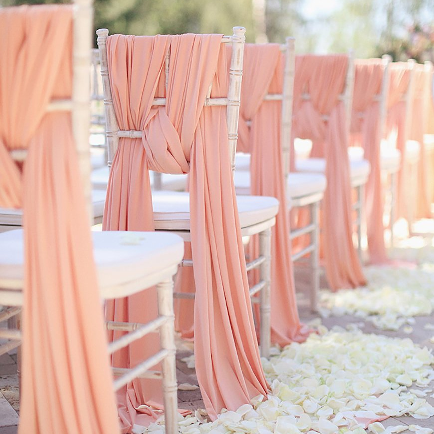 Decorated chairs at fresno Wedding Festival chair ties, chair drapes, chiavari chairs