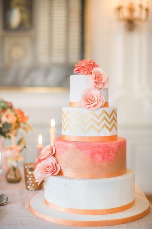 a beautiful pink and tangerine cake at fresno bridal show