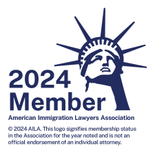 The logo for the american immigration lawyers association shows the statue of liberty.