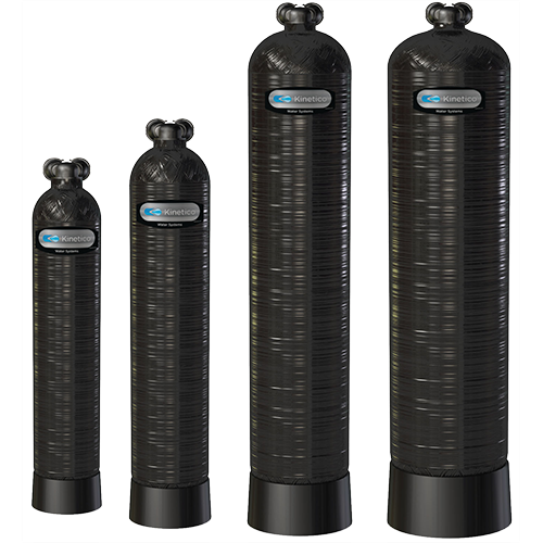 Four black water filtration tanks of varying sizes.