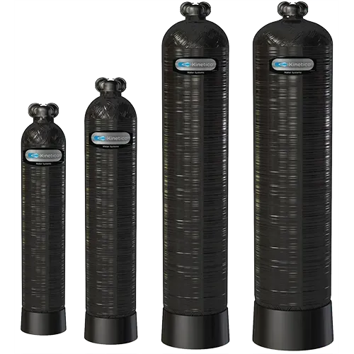 Four black water filtration tanks of varying sizes.