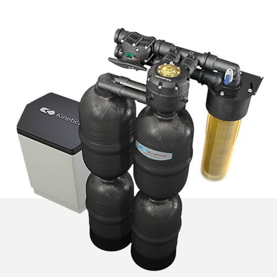 Water softener and filter system with black tanks, a beige filter, and a salt tank.