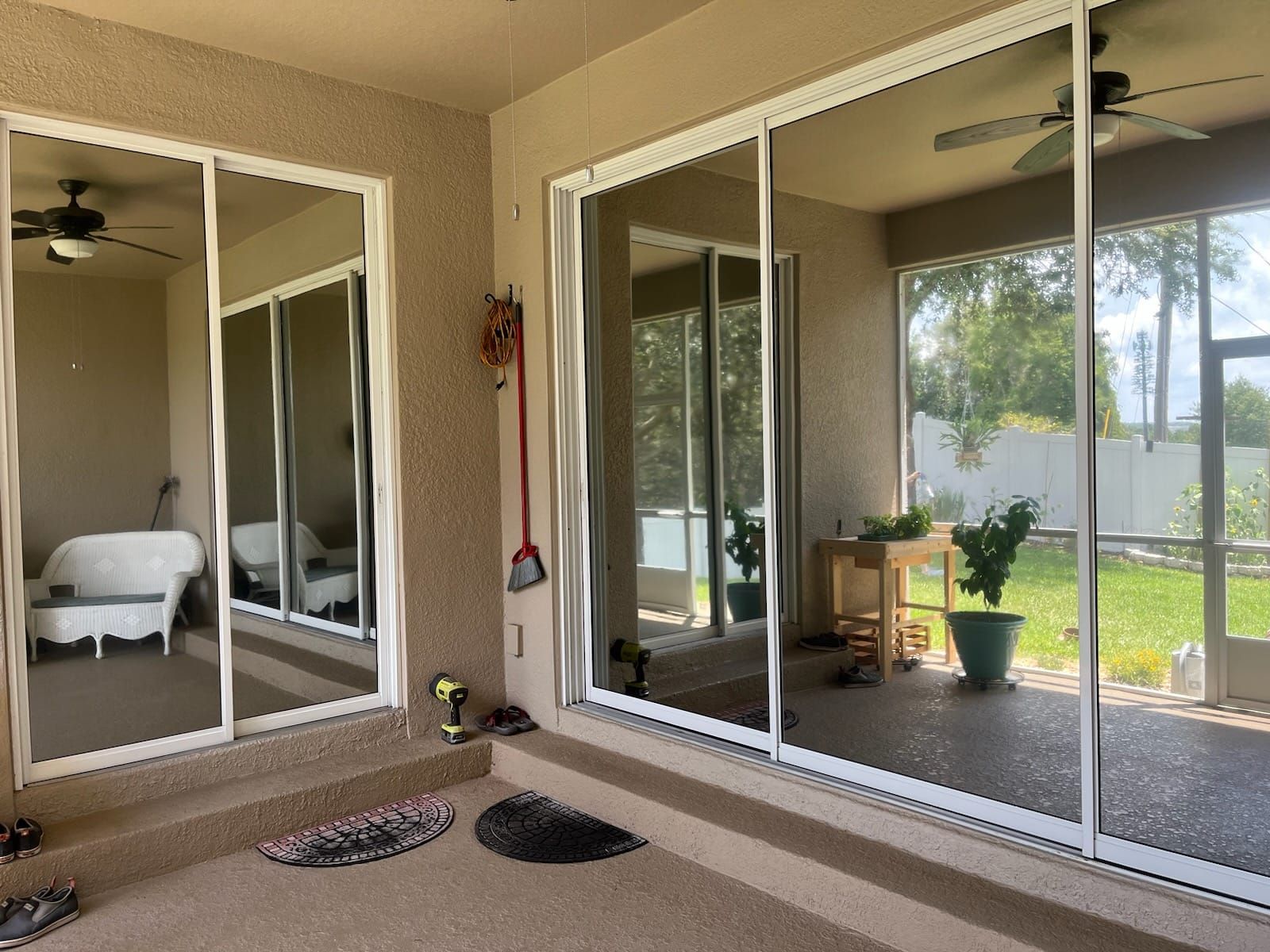 A room with a lot of mirrors and sliding glass doors