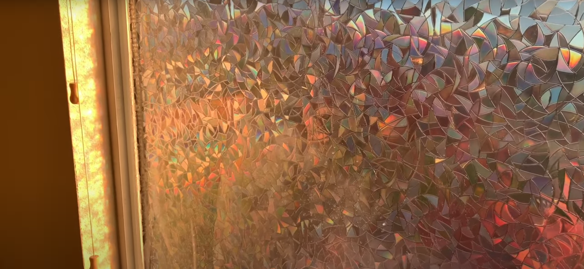 A close up of a window with a painting on it.
