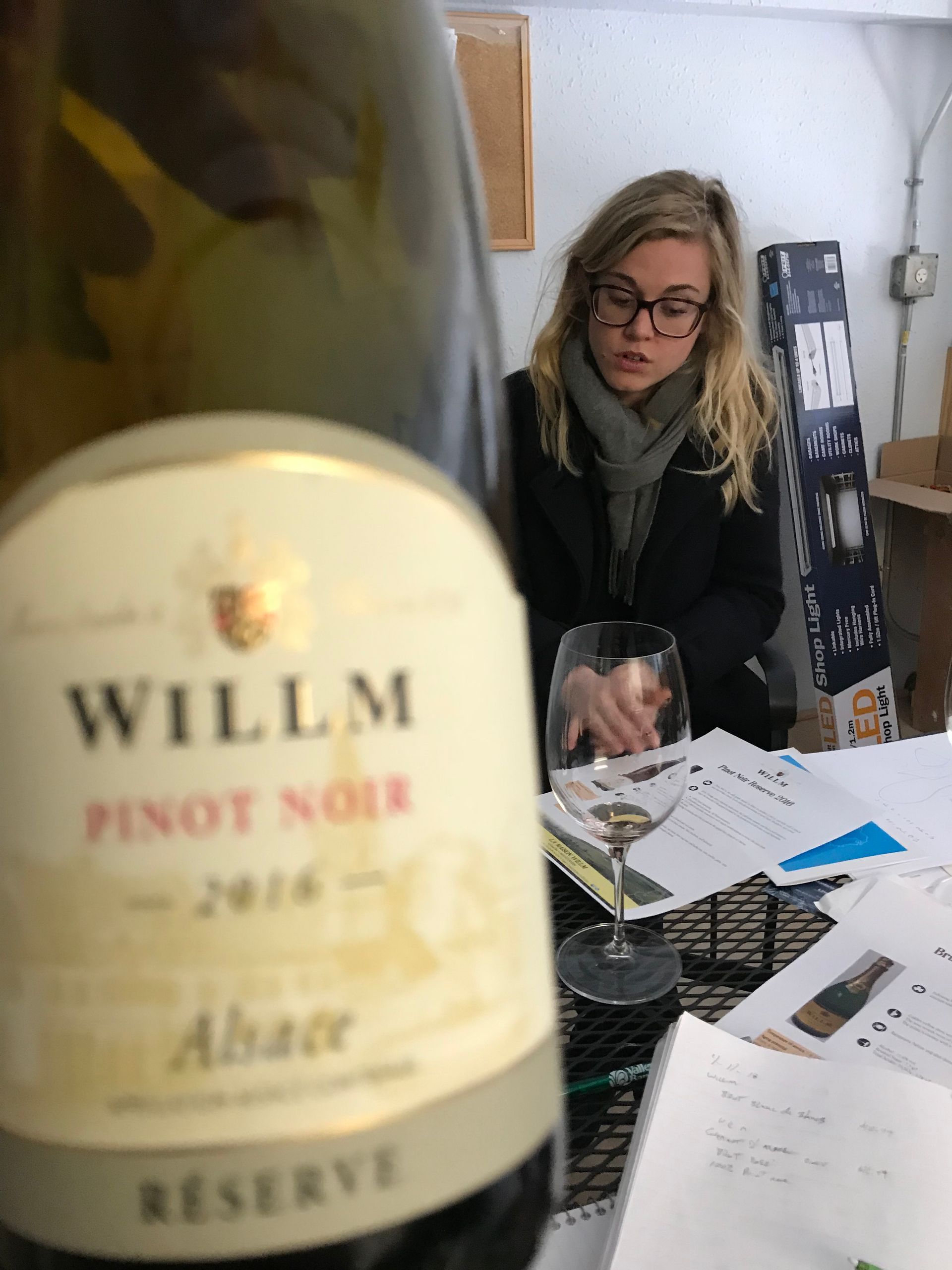 A bottle of willm pinot noir sits on a table
