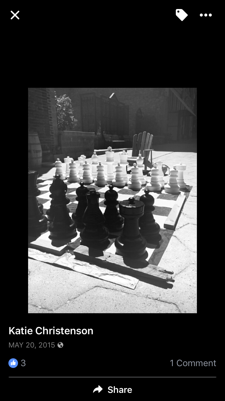 A black and white photo of a large chess board.