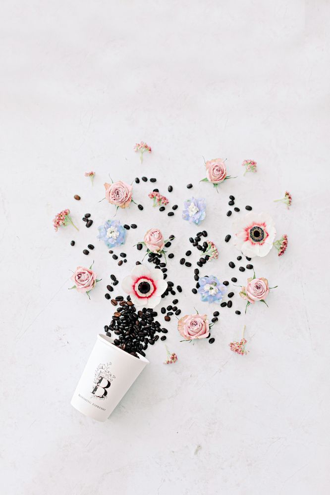 Cup Filled with Coffee Beans and Flowers — Gig Harbor, WA — Blooming Espresso