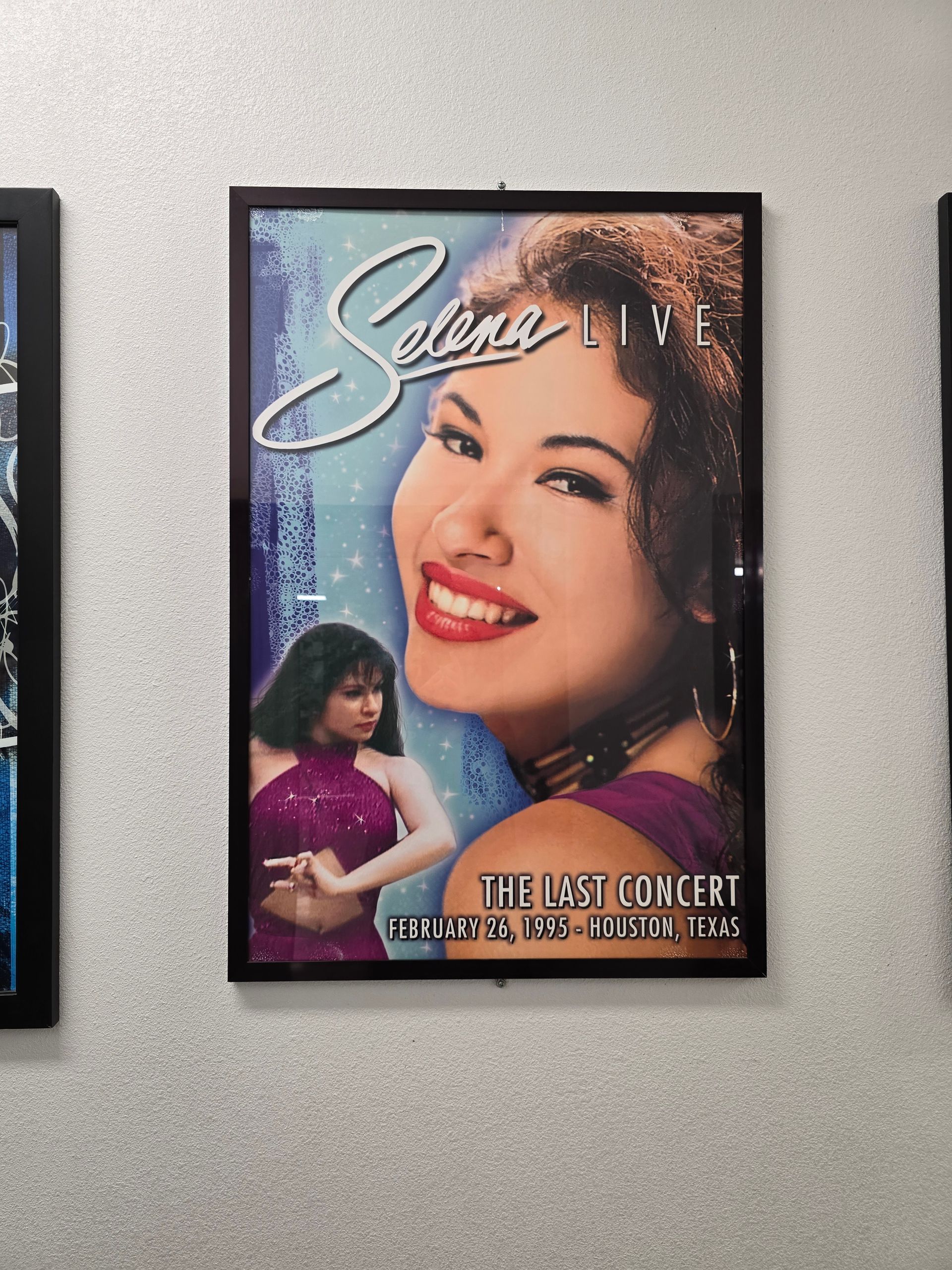 a poster of selena quintanilla hanging on a wall