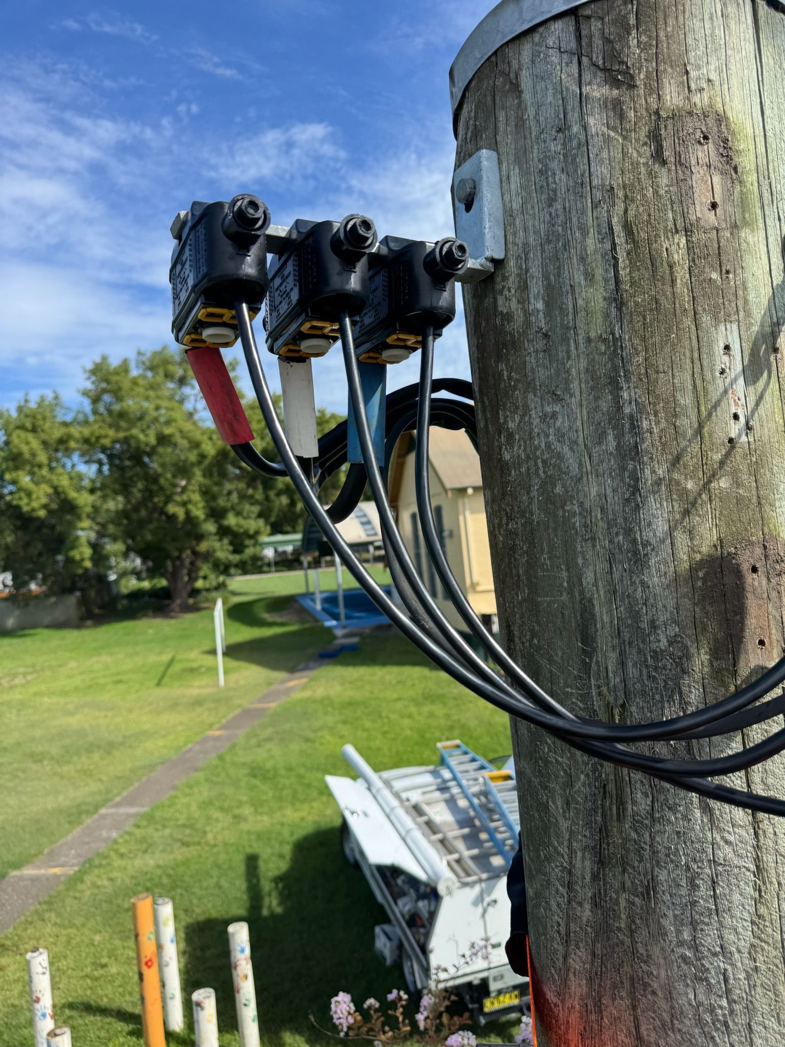 HIgh Voltage cables on a pole— DMP Electrical Contractors In Maitland, NSW