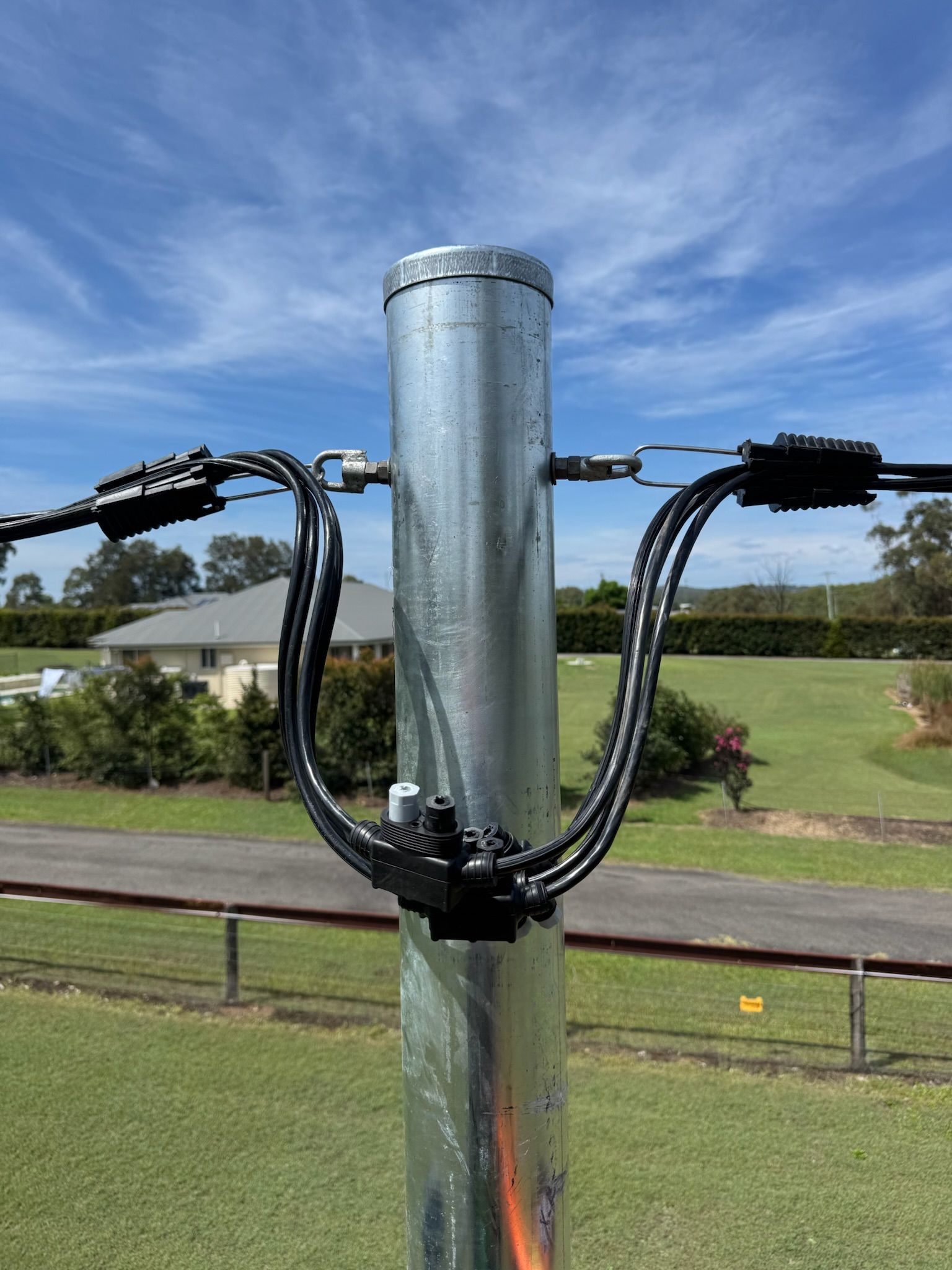 Black Cableattached to a pole— DMP Electrical Contractors In Lake Macquarie, NSW