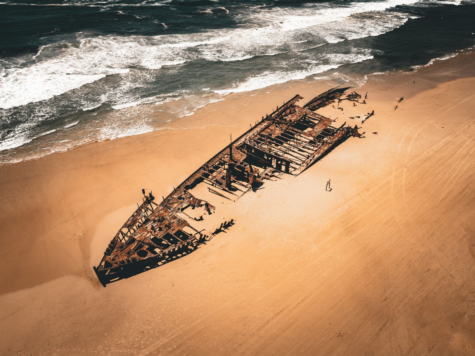 An Aerial View Of A Ship Wreck On The Beach — Jack West Photography In Kawungan, QLD