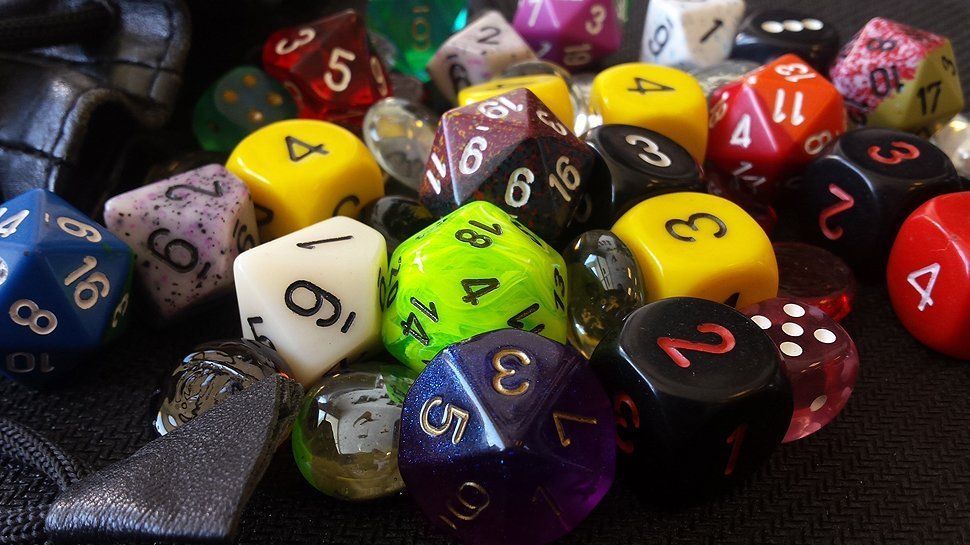 A pile of assorted, colorful multi-sided gaming dice.