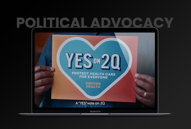 A person is holding a sign that says yes on 20q