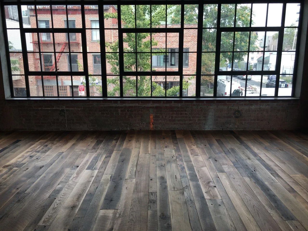 Old face hardwood flooring in apartment