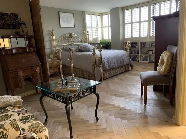 Bedroom suite herringbone hardwood flooring