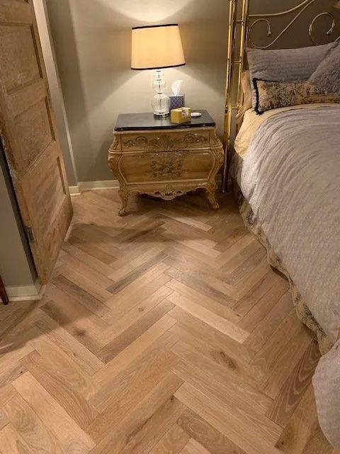 Bedroom suite herringbone hardwood flooring