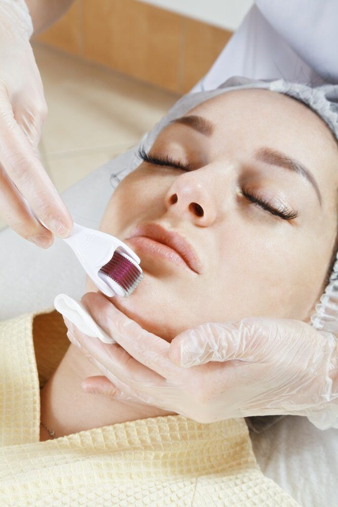 Woman Undergoing a Microneedling Facial Treatment, Eyes Closed — Body Sanctuary in Anula, NT