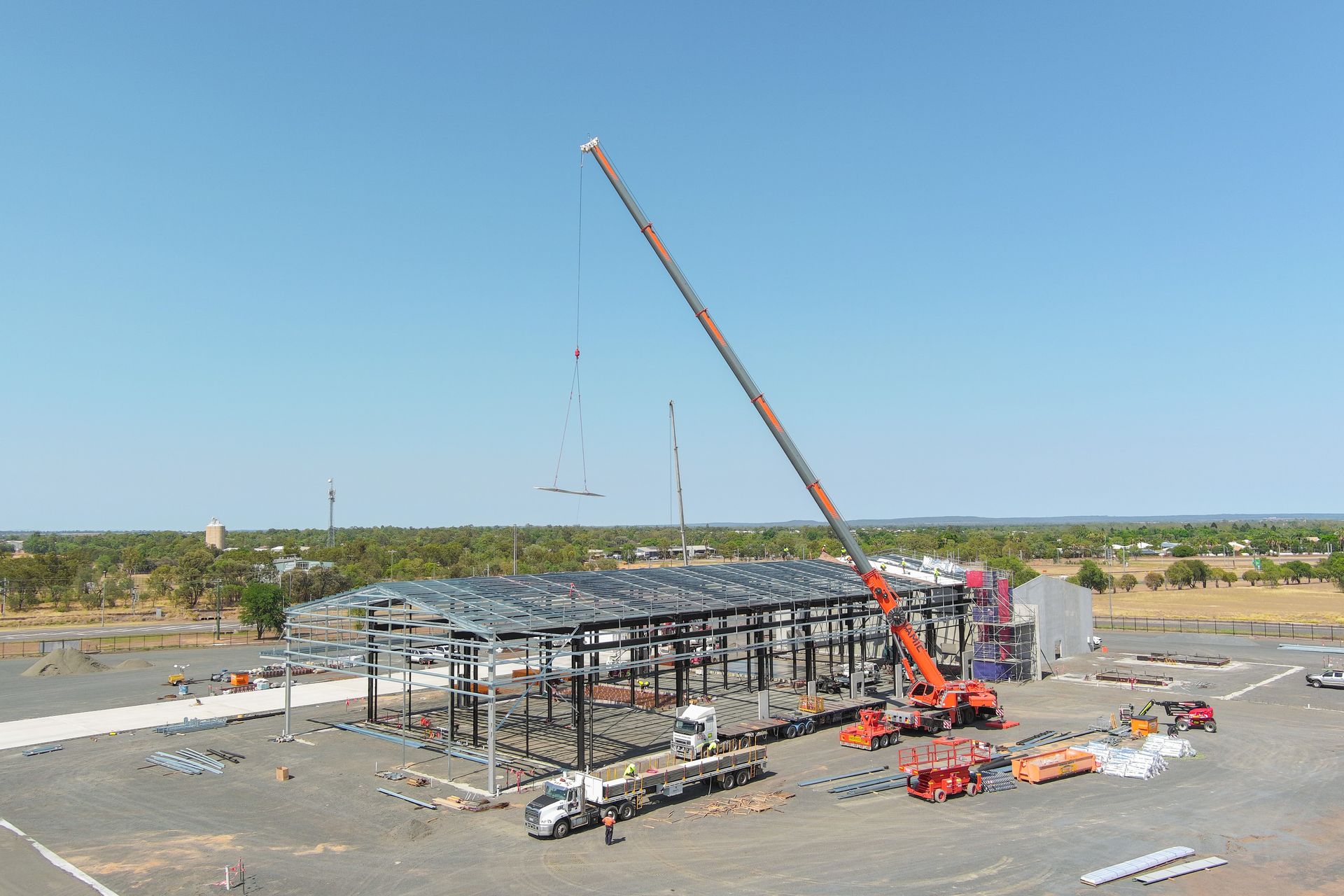 An Aerial View Of A Large Building Under Construction With A Crane In The Foreground — Dynamic Crane Hire In Emerald, QLD