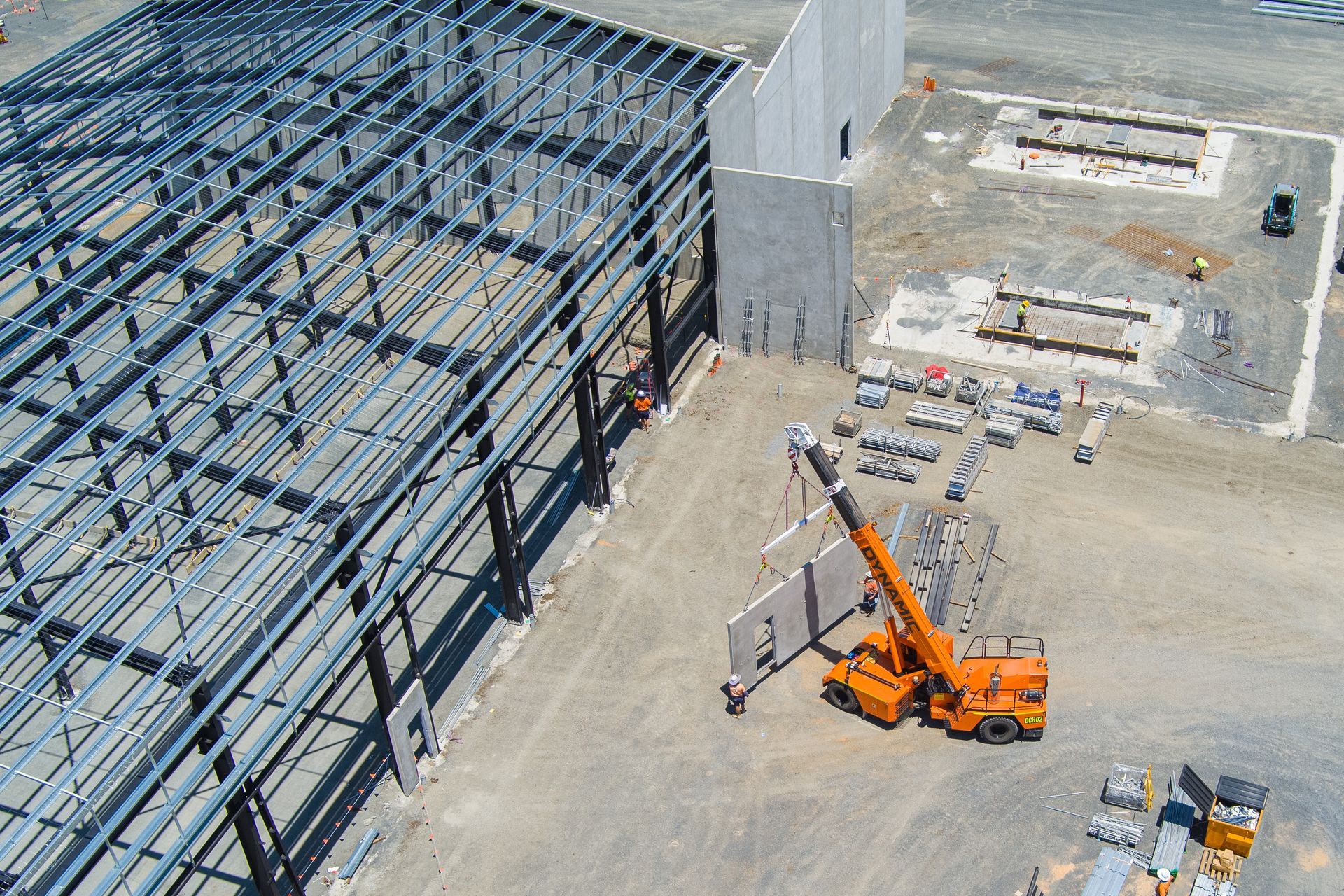 An Aerial View Of A Building Under Construction With A Crane In The Foreground — Dynamic Crane Hire In Emerald, QLD