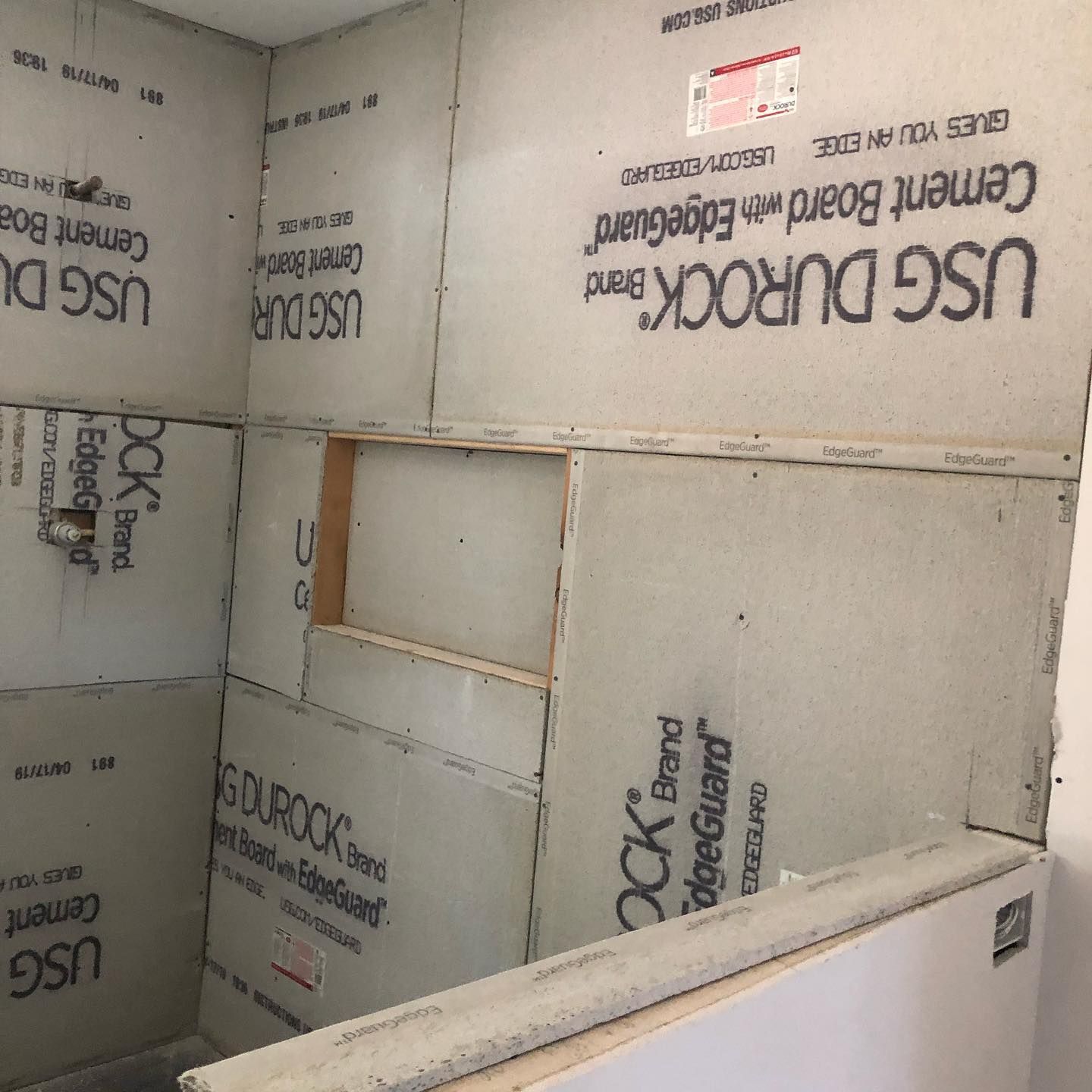 A room with usg durrock cement board with edgeguard
