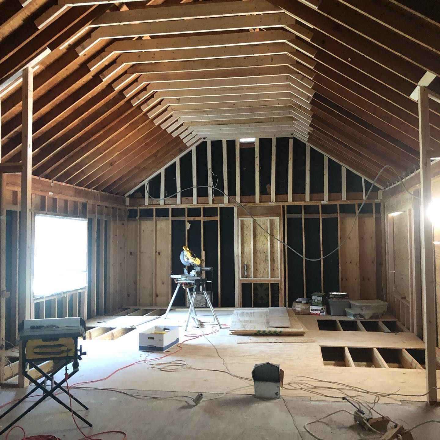 A room that is being built with a vaulted ceiling