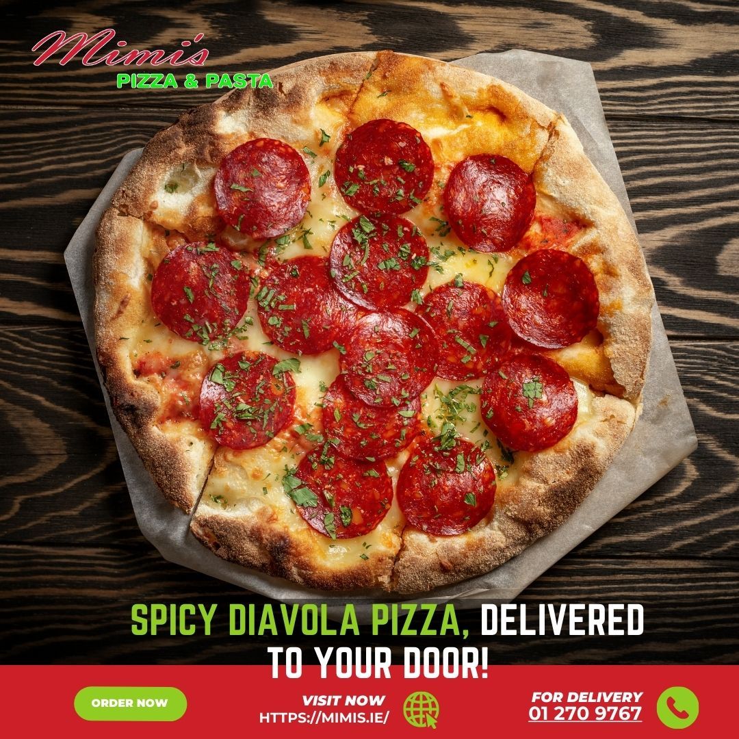 A pizza with pepperoni and cheese is sitting on a wooden table.