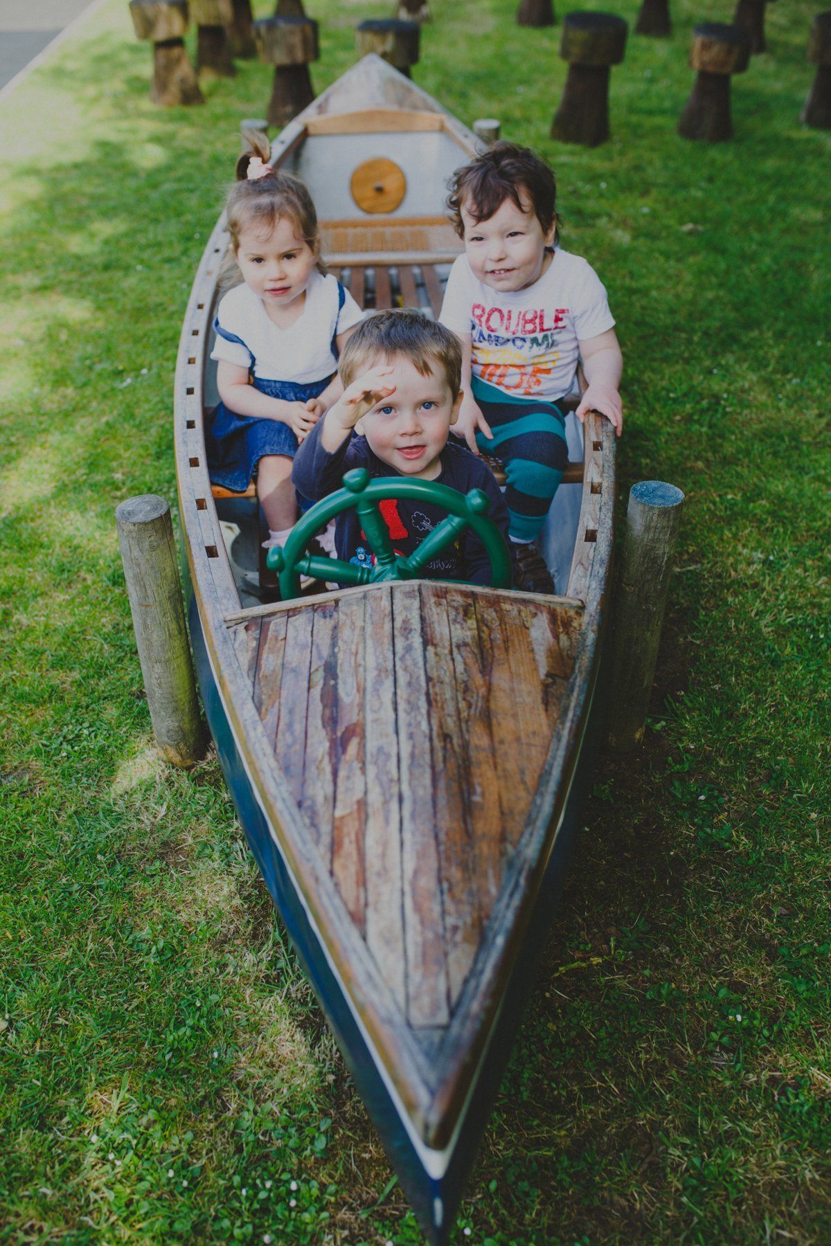 kids in an artificial boat