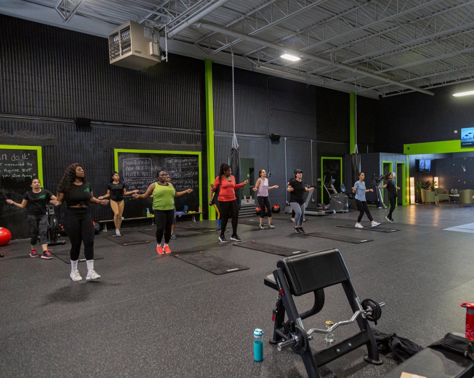 a group of women are jumping rope in a gym